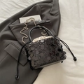 Black sequin bucket bag with drawstring liner and metallic chain shoulder strap - Black
