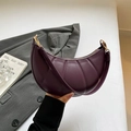 Deep purple croissant shoulder bag with quilted texture and gold-tone metal hardware - Burgundy