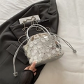 Silver sequin drawstring bucket bag with shiny metallic finish and chain strap - Silver