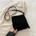 Retro black faux suede crossbody bag featuring long fringes and adjustable silver strap - Black