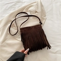 Dark brown faux suede crossbody bag with long fringes and bohemian vintage aesthetic - Brown