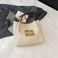 Elegante borsa tote in paglia beige con manici in pelle marrone e ricamo min min - Beige E Marrone