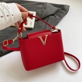 Red textured leather crossbody bucket bag with elegant gold V-shaped metal hardware - Red