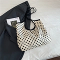 Polka dot canvas tote bag with black shoulder straps on a minimalist background - Khaki