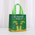 Close-up of St. Patrick's Day non-woven gift bag with leprechaun legs and gold coins - Leprechaun Legs Pattern Style (9025-4)