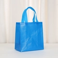 Detail of blue non-woven bag showing durable cross-embossed texture and reinforced handle - Lake Blue