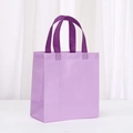 Detailed macro view of reinforced handles and honeycomb texture on the purple gift bag - 23*22*11 / Macaron Purple