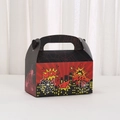 Macro detail of comic hero gift box featuring pop-art graphics and heart buckle - Red Black