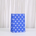 Blue kraft paper gift bag with white stars and rope handles for holiday shopping - Blue Stars Minimalist Theme (485-1)