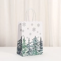 Detail of white kraft gift bag with festive forest print and sturdy paper rope handle - Deep Blue Winter Forest Style (452-4)
