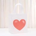 Reusable white non-woven shopping bag with a vibrant red heart print and sturdy handles - 23x22x11 / White