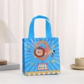 Detail of blue non-woven gift bag with circus lion print and yellow wave trim edge - Blue Lion (9017-3) / 20*20*9