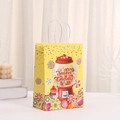 Yellow kraft paper gift bag with colorful candy machine print and white rope handles - Bright Yellow Candy Machine (431-2)