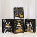 Schwarze Weihnachtstüten mit goldenen Rentier-Motiven und eleganten Kordelgriffen - Klein (23x18x10)
