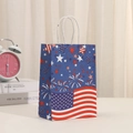 Detail of USA flag themed gift bag with fireworks design and durable white paper handles - Dark Blue Starry Flag Style (400-4)
