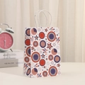Detail of kraft paper gift bag with USA Independence Day fireworks and white rope handles - Holiday Fireworks And Stars Style (400-5)