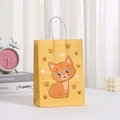 Detail of yellow paper gift bag featuring a cute orange cartoon cat and white rope handles - Yellow Cat Style (407-4)
