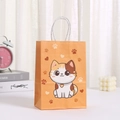 Orange kraft paper gift bag featuring a cute cartoon cat print with white woven handles - Calico Cat Style (407-6)