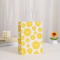 Kraft paper shopping bag with vibrant lemon prints and durable white rope handles - Bright Yellow Lemon Slice Pattern (410-3)