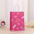 Detailed view of pink gift bag with crown prints and white twisted rope handle - Rose Red Crown Style (373-4)