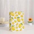 Eco-friendly white kraft paper gift bag featuring watercolor lemon print and twisted rope handles - Watercolor Lemon Pattern (410-5)