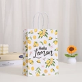 Detail of kraft paper gift bag with lemon prints, white rope handle and hello lemon art text - Hello Lemon Artistic Lettering Style (410-2)