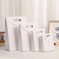 Set of four white kraft paper gift bags with flip lids and decorative silk bows - 16*12*6cm / White