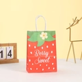 Detail of strawberry gift bag with Berry Sweet print and decorative green leaf handle - Red Strawberry Pattern (260-1) / 21*15*8