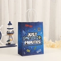 Sac cadeau en papier bleu thème gamer avec manette et poignées blanches pour fêtes - Style Gamer (421-5)