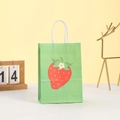 Detail of green paper gift bag with strawberry illustrations and white rope handles - Green Strawberry Pattern (260-2) / 21*15*8