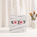 Close-up of Halloween non-woven gift bag with mummy print and red eyes pattern - 9014-3