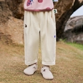 Kids beige corduroy pants with Amila embroidery and loose fit on a natural background - Apricot / 100cm