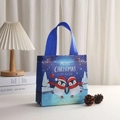Close-up of a blue Christmas gift bag with skating penguins and festive snowflake patterns - 20*9*20 / Skating Penguins (9016-6)