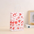 Close-up of white gift bag with red heart patterns and white rope handle detail - Heart Tree Lines Style (369-4)