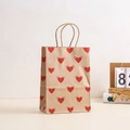 Brown kraft gift bag with winged red hearts and paper handles for Valentine party favors - Kraft Paper Winged Heart Style / 21*15*8
