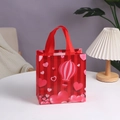 Red non-woven party gift bag with heart patterns and hot air balloon on a white table - Hot Air Balloon Stripe Style (4006-4) / 23*22*11