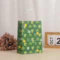 Detail of St. Patrick's Day paper gift bag with green clover pattern and rope handles - Vertical Stripe Shamrock Pattern (370-5)