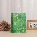 Green kraft paper gift bag with shamrock pattern and white twisted rope handles - Dense Small Shamrock Pattern (370-2)