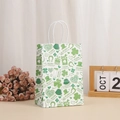 White St. Patrick's Day paper gift bag with green clover patterns and sturdy handles - Festive Icons Collection Style (370-3)
