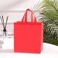 Bright red waterproof non-woven tote bag for shopping and gifts on a white table - 29*27*12cm / Red
