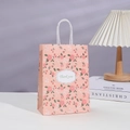 Sacchetto regalo floreale in carta con manici bianchi e scritta Thank You su tavolo bianco - Stile Floreale Rosa (201-1) / 21x15x8cm
