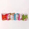 Detail showing six colorful kraft paper gift bags with Happy Birthday cartoon designs - Mixed Colors Shipped Randomly