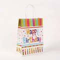 Detail of white Happy Birthday kraft paper gift bag with colorful handles and candles - H21*L15*W8 / Candle Style (601-2)