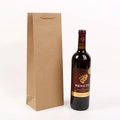 Detailed view of heavy-duty brown kraft paper wine gift bag with single bottle capacity - Natural
