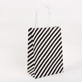 Bolsa de regalo minimalista de papel kraft con rayas negras y blancas y asas blancas - Grande / Negro