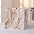 Elegant white marble gift paper bag with gold foil details and silk handles - Medium Size / White Marble Pattern