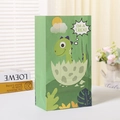 Detail of green cartoon dinosaur kraft gift bag with sturdy handles and Rex graphics - Green Dinosaur Egg Style