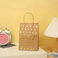 Kraft paper gift bag with golden polka dots and twisted rope handles for parties - Gold Dots/Kraft Base