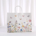 Witte papieren cadeautas met bloemen- en vlinderprint en witte koordhandvatten - 950-1 (32*25*11cm)