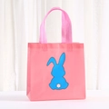 Detailed view of pink non-woven gift bag with blue rabbit silhouette and reinforced handles - 20*20*9 / Pink (9062-2)
